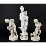 Two 19th century Parian figures, one a boy holding a puppy, and a young girl with basket of chicks,