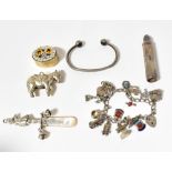 Various silver items to include a charm