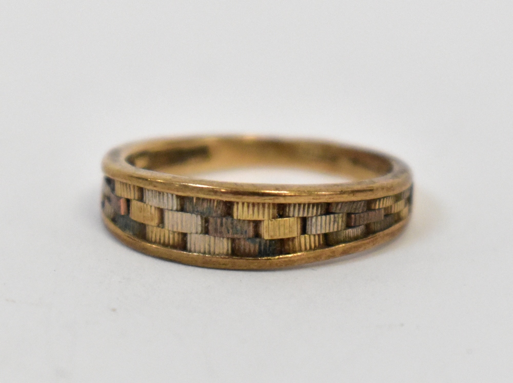 A 1980s 9ct gold ring, the oval head wit