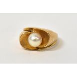 A contemporary 9ct gold pearl ring, the