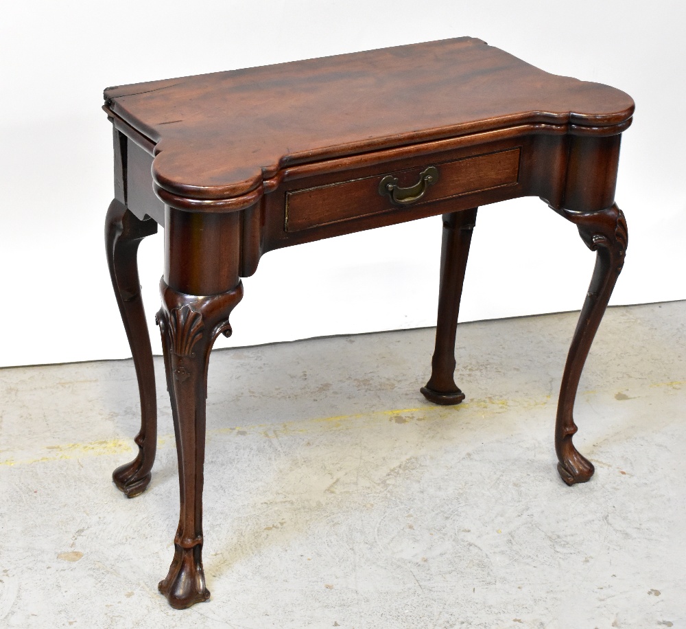 A George II mahogany fold-over tea table