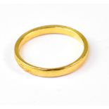A 22ct yellow gold wedding band, size N,