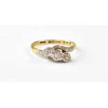 An 18ct yellow gold dress ring with thre