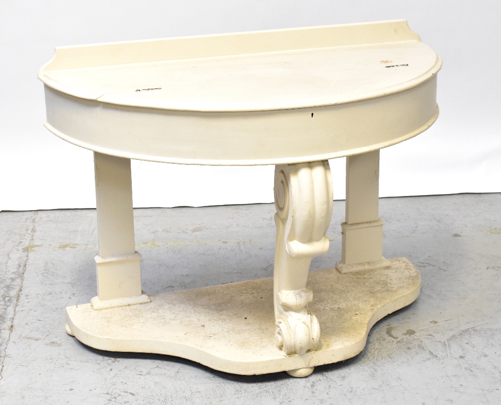 A white painted demi-lune console table