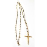 A 9ct yellow gold crucifix and a long 9c