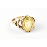 A 9ct yellow gold dress ring with oval f