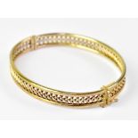 A 9ct yellow gold lattice bangle, approx