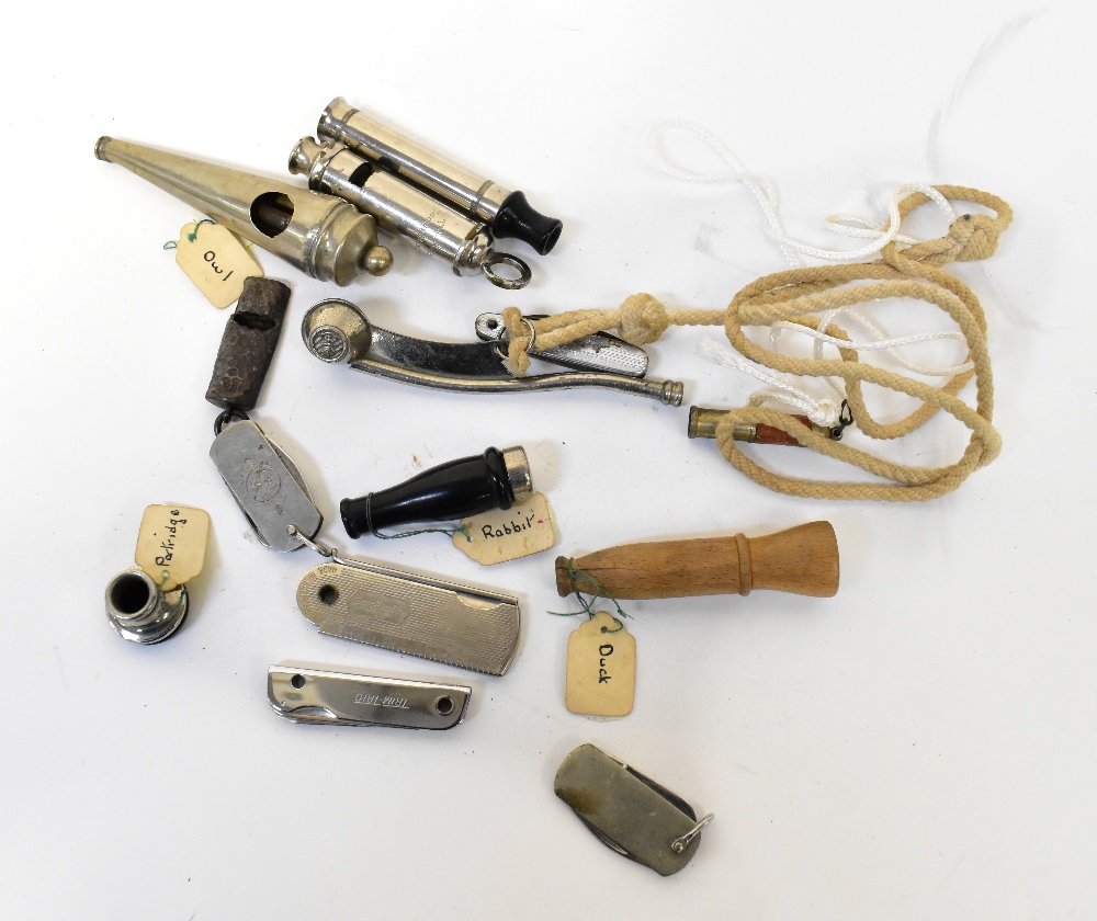 A quantity of whistles, including duck,