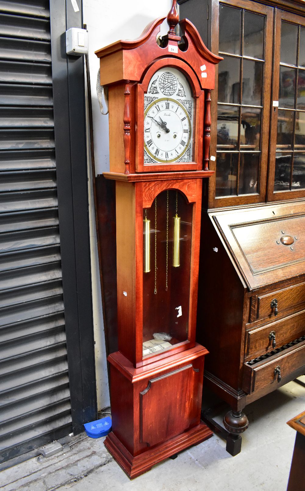 A 20th century oak cased chiming grandmo