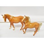 BESWICK; two gloss palomino horses, a ma