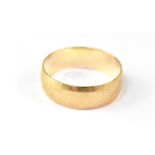 A 9ct yellow gold wedding band, size U,