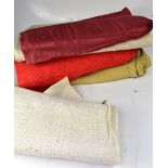 A quantity of rolls of vintage fabric in