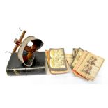 A vintage wooden stereoscope viewer and