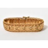 WITHDRAWN: An 18ct yellow gold bracelet with stepped square links with incised decoration,
