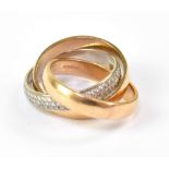 An 18ct yellow and white gold trilogy ring,