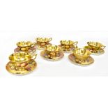 COALPORT; seven pairs of hand painted 'Fallen Fruit' pattern tea cups and saucers,