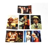 DOCTOR WHO; six photographs bearing the signatures of actors who have played The Doctor,