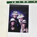 ABBA; a promotional photo postcard bearing the signatures of the four members, 14.5 x 10.5cm.