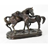UNATTRIBUTED; a bronze figure group of two horses, on a naturalistic base,
