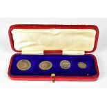 A George V set of set of Maundy money 1910, in original red leather case.