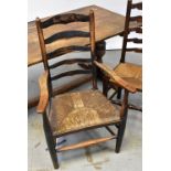 A 19th century ash and elm hoop back Windsor arm chair of small proportions,