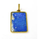 An 18ct gold necklace pendant of tablet form with rectangular blue stone, in 9ct gold mount, 3.