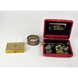 A pink velvet jewellery case containing a quantity of vintage jewellery,