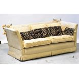 DURESTA; a Knoll-style three-seater settee upholstered in beige damask-style fabric,