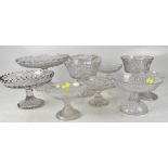 A good collection of mainly 19th century pressed and moulded glass cake stands and pedestal bowls,