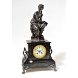 A 19th century slate marble inlaid eight day clock with spelter young woman to the top,