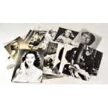 A large collection of movie still style lobby or stock cards, mostly black and white,