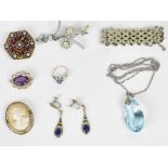 A small collection of costume jewellery to include brooches, bracelet, ring, earrings, etc.