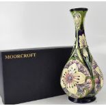 MOORCROFT; an onion-shaped slender tall vase, opal floral design in Art Nouveau manner,