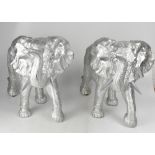 Two decorative moulded silver-coloured elephant figures, 45 x 70cm (2).