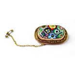 A vintage Italian brooch with centre millefiori cabochon in 9ct gold mount with rope twist border