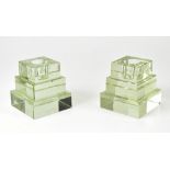 A pair of Art Deco style glass ziggurat-shaped candlesticks, height of each 10cm (one af) (2).