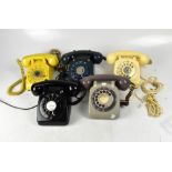 Five vintage telephones, to include a Bell System by Western Electric in mustard yellow,