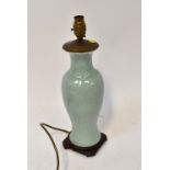 A porcelain celadon-style slender baluster vase, later converted to a lamp, height 40cm.