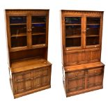 A pair of mid-20th century oak priory-style display/book cabinets,