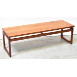 G-PLAN; a 1960s teak rectangular coffee table with stylised end supports, 42 x 137 x 46cm.