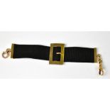 A Victorian ribbon bracelet with 15ct gold buckle, capped ends with hoop and swivel clasp,