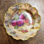 FRANK ROBERTS FOR ROYAL WORCESTER; a hand painted cabinet plate depicting plums and strawberries,