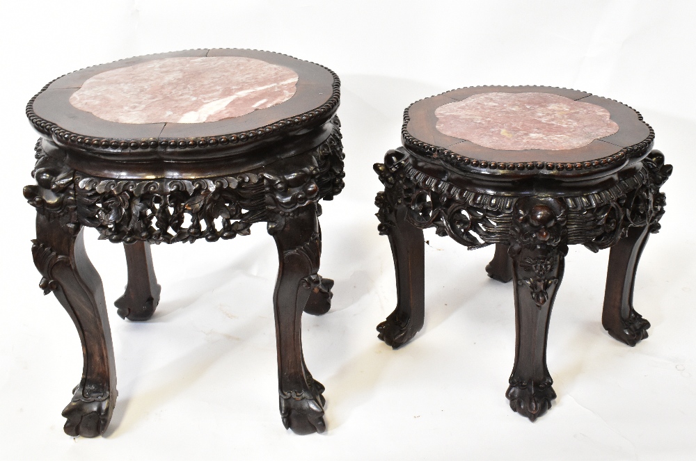Two Chinese carved hardwood and marble inset low tables or stands,