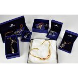 A quantity of boxed Trifari and Swarovski costume jewellery, to include necklaces, bracelets,