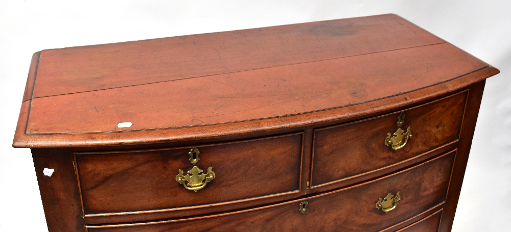 A Victorian mahogany bow front chest of two short over three long drawers, raised on bracket feet, - Image 2 of 3