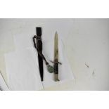 A German Third Reich WWII dress bayonet with blade marked 'WKC', with scabbard and pommel strap,