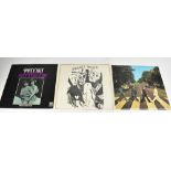 Three LPs comprising The Beatles, 'Abbey Road', Bob Dylan, 'Planet Waves' on UK Palm Tree pink rim,