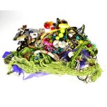 A large quantity of modern and vintage costume jewellery to include earrings, brooches, bangles,