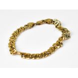 A 9ct gold flat link bracelet with lobster claw clasp, length 19cm, approx 17.6g.