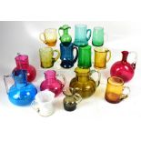 A collection of vintage coloured glassware to include jugs, ewers, mugs and cups (16).